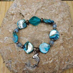 Dolphin Charm blue shell stretch bracelet. Handmade one of a kind.